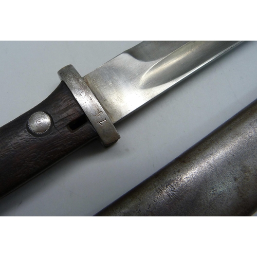 853 - A German bayonet 1884/1898, the scabbard marked Durkopp, the blade marked 7950, scabbard marked 1044