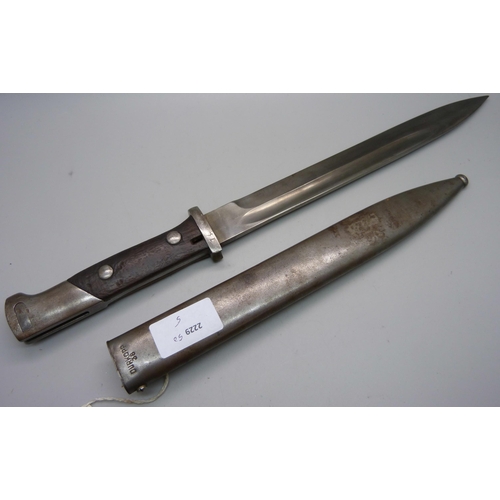 853 - A German bayonet 1884/1898, the scabbard marked Durkopp, the blade marked 7950, scabbard marked 1044