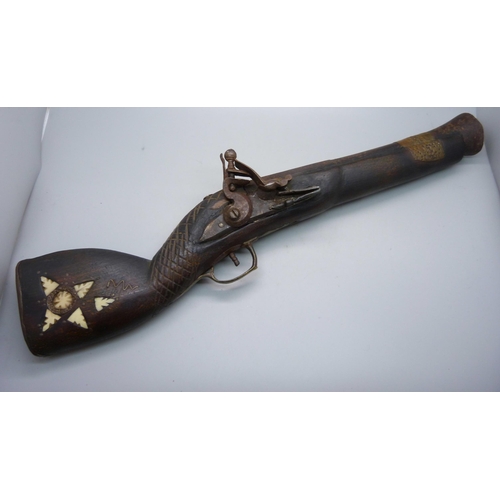 854 - A flintlock overcoat pistol