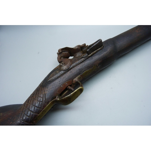 854 - A flintlock overcoat pistol