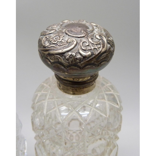 857 - Two silver mounted scent bottles