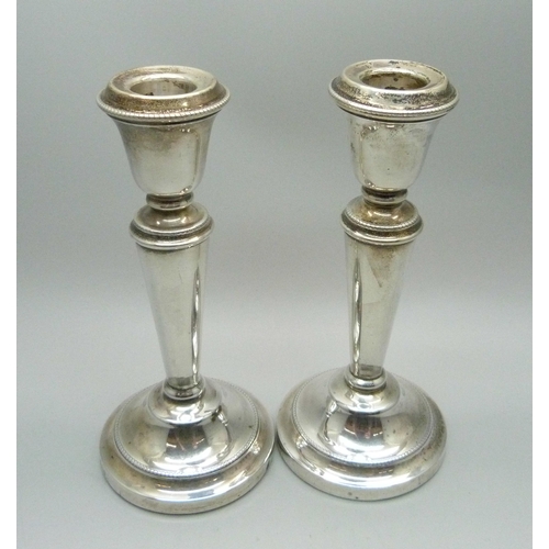 863 - A pair of silver candlesticks, 14cm