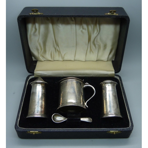 869 - A silver salt, pepper and mustard with mustard spoon, 240g, cased