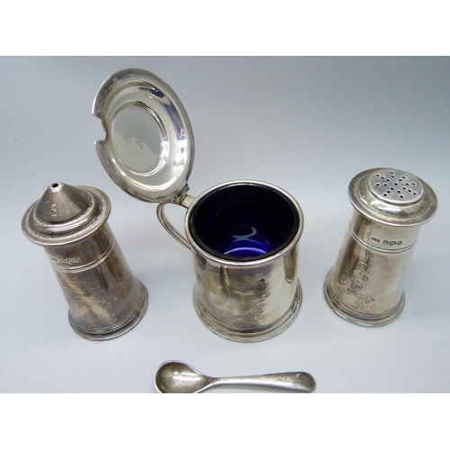 869 - A silver salt, pepper and mustard with mustard spoon, 240g, cased