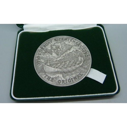 873 - The Royal Mint, a silver commemorative Lifeboat Medallion, cased, 153g