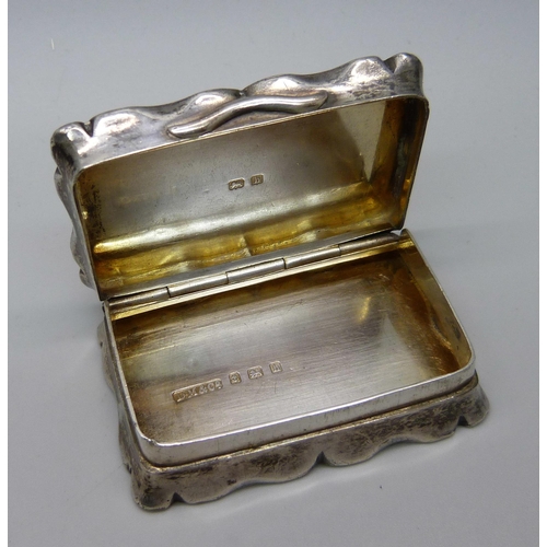 898 - A silver snuff box, Birmingham 1908, Davis, Moss & Co., 44g, 54mm wide