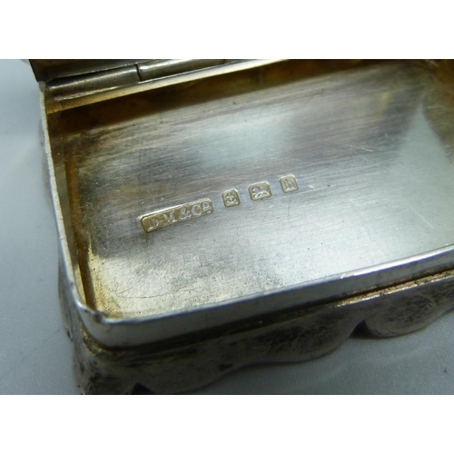 898 - A silver snuff box, Birmingham 1908, Davis, Moss & Co., 44g, 54mm wide