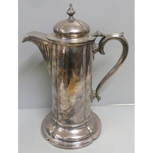 900 - A large white metal flagon, marks on the rim, 36cm tall, (1400g)