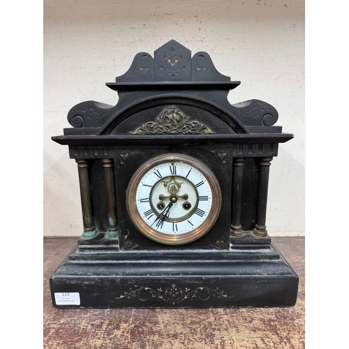 319 - A 19th Century French Belge noir mantle clock