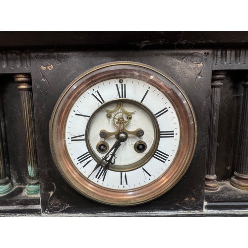 319 - A 19th Century French Belge noir mantle clock