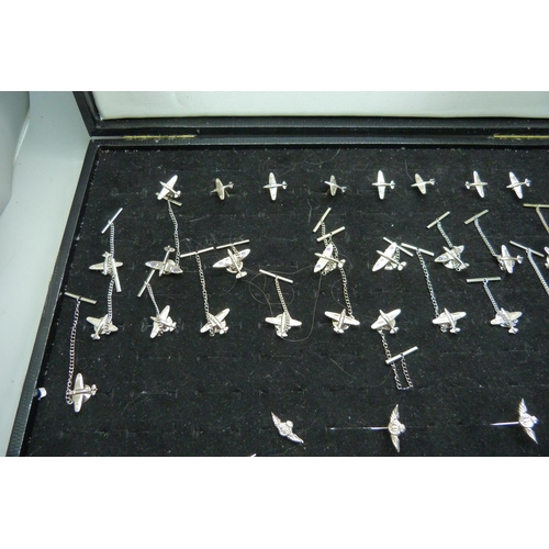 909 - A collection of silver spitfire tie-pins, cufflinks and RAF stick pins