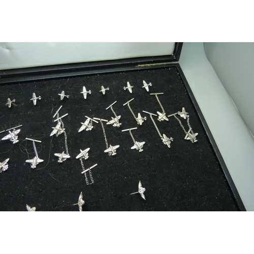 909 - A collection of silver spitfire tie-pins, cufflinks and RAF stick pins