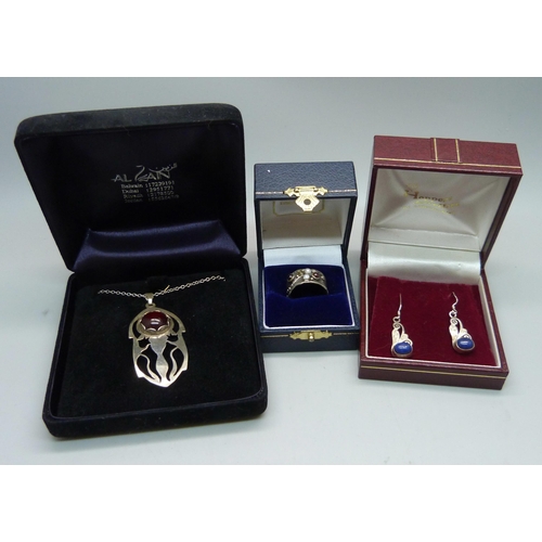 912 - An Art Nouveau ring, a pair of silver earrings, and a pendant on a silver chain