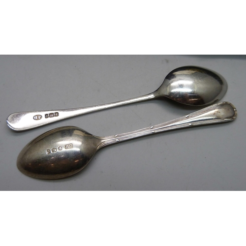 914 - Two sets of six silver spoons, 150g