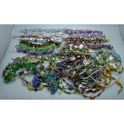 925 - Tibetan silver mounted semi-precious and glass bracelets, (773g), and similar necklaces, (553g)