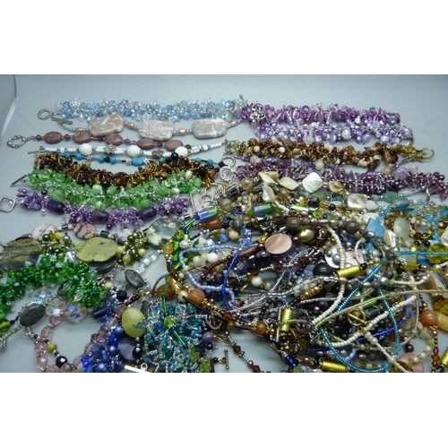 925 - Tibetan silver mounted semi-precious and glass bracelets, (773g), and similar necklaces, (553g)