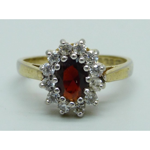 965 - A silver gilt, garnet and zircon cluster ring, O