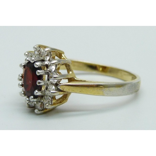 965 - A silver gilt, garnet and zircon cluster ring, O