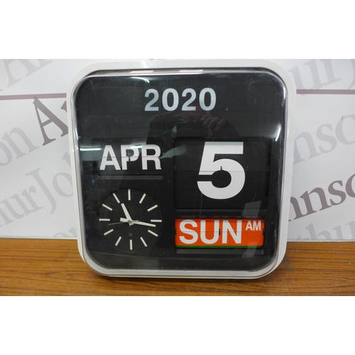 2128 - A battery operated auto calendar quarts clock