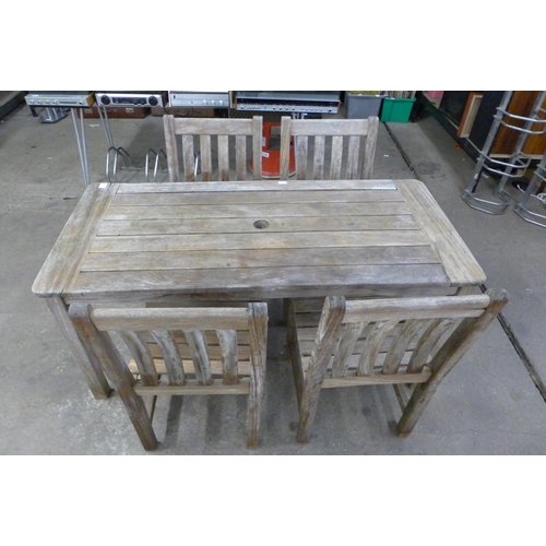 2132 - A garden patio set including an Iroko timber 150 x 70cm wooden table and four Bridgman Iroko timber ... 