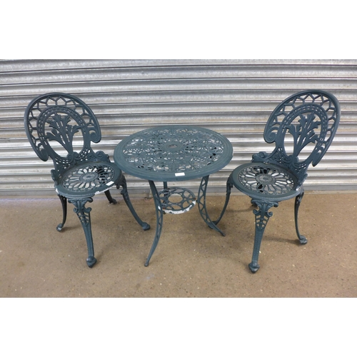 2133 - An aluminium cast metal garden table and two chairs