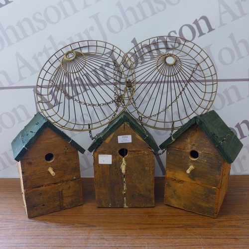 2152 - 3 wooden bird boxes and two metal hanging baskets