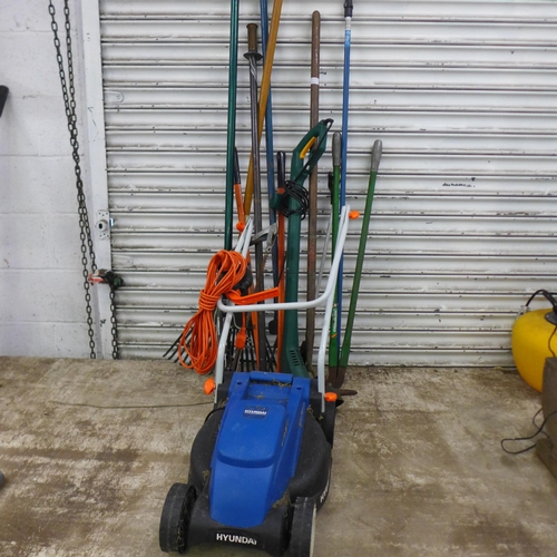 2155 - A quantity of gardening tools including a Hyundai HYM3200E electric lawn mower, an electric grass st... 