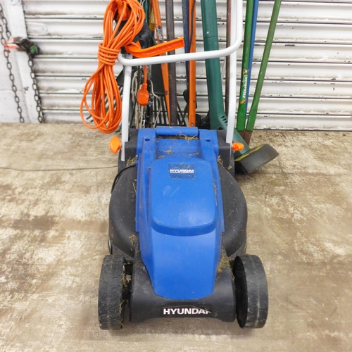 2155 - A quantity of gardening tools including a Hyundai HYM3200E electric lawn mower, an electric grass st... 