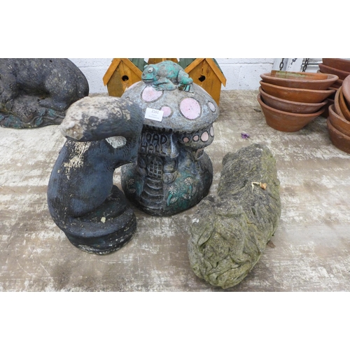 2161 - Three stone effect concrete garden ornaments including 'Toad Hall' toadstool mushroom, an otter and ... 