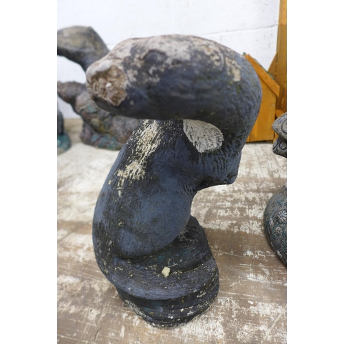 2161 - Three stone effect concrete garden ornaments including 'Toad Hall' toadstool mushroom, an otter and ... 