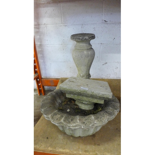 2173 - A three part stone effect concrete planter with pedestal base