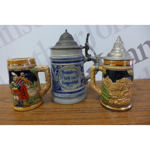 2212 - A small crate of 9 German collectable steins, a J Walker jug and a port decanter