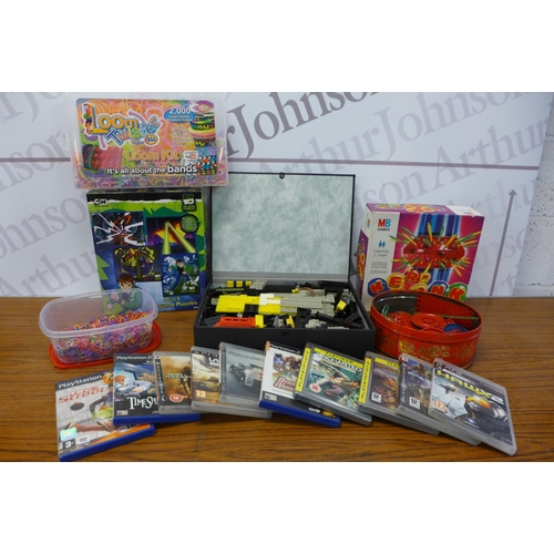 2258 - A box of various games and other items including: a box of Lego, Ben 10 puzzles, a box of loom bands... 