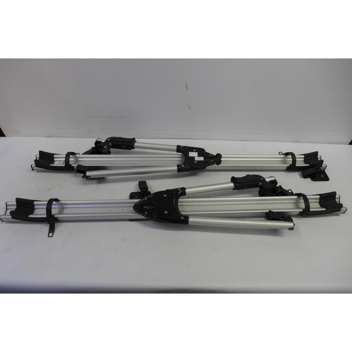 2277 - A set of Volvo roof bar bike carriers