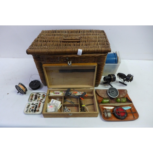 2279 - A Wicker fishing basket with a quantity of fishing equipment