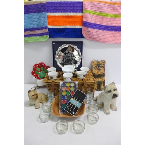 2284 - A box of assorted household items including a wicker basket, glassware, a metal commemorative plate,... 