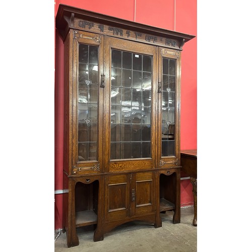 113 - An Arts and Crafts Liberty & Co. oak bookcase