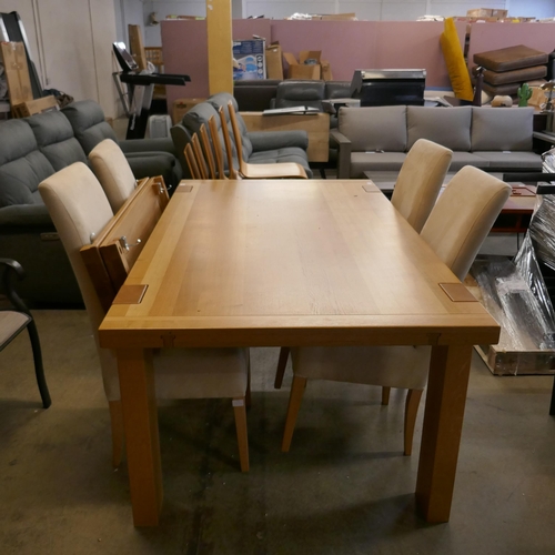 1516 - An oak extending dining table and four chairs