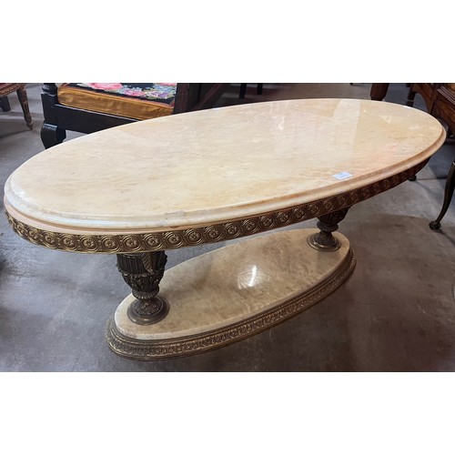 116 - A French gilt metal and marble topped oval coffee table