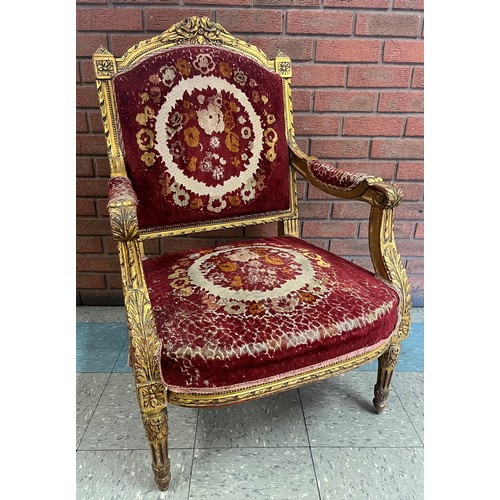 117 - A French Louis XIV style giltwood and fabric upholstered fauteuil chair