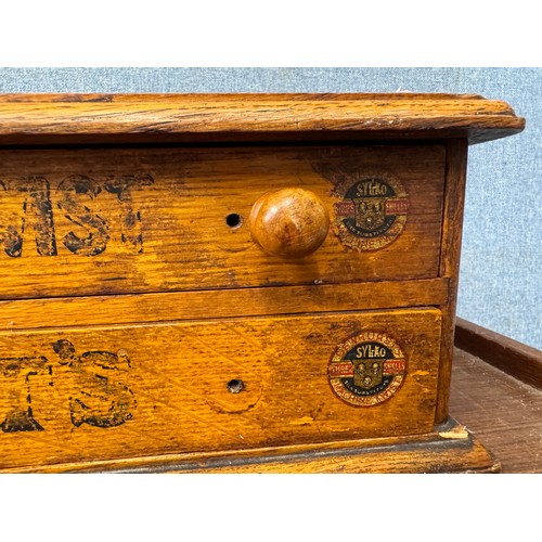 346 - An early 20th Century Dewhurst's Sylko oak counter top shop haberdashery cabinet