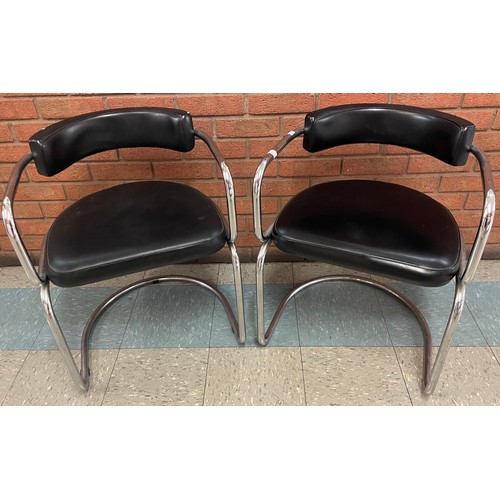 84 - A pair of chrome and black vinyl chairs