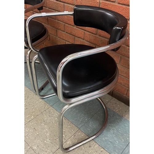 84 - A pair of chrome and black vinyl chairs