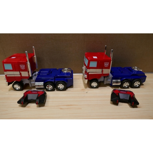 3161 - 2x R/C Transformers Optimus Prime with remotes (324-53) *This lot is subject to vat