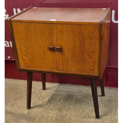 14 - A teak two door record cabinet