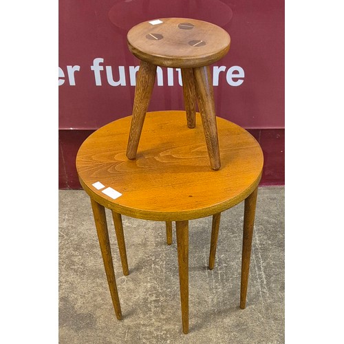 25 - A teak stool and a teak circular coffee table