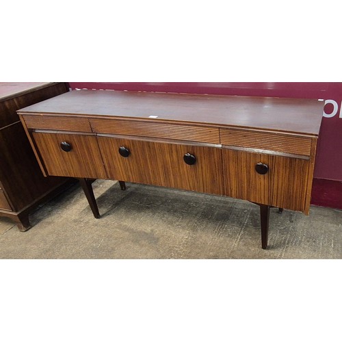 23 - An Elliotts of Newbury afromosia concave sideboard