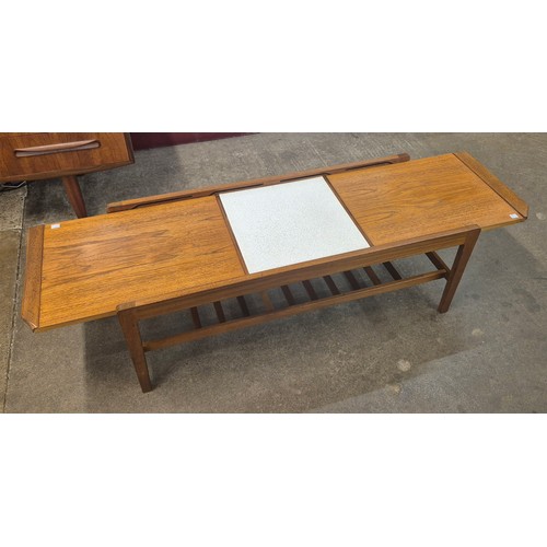 33 - A teak extending coffee table