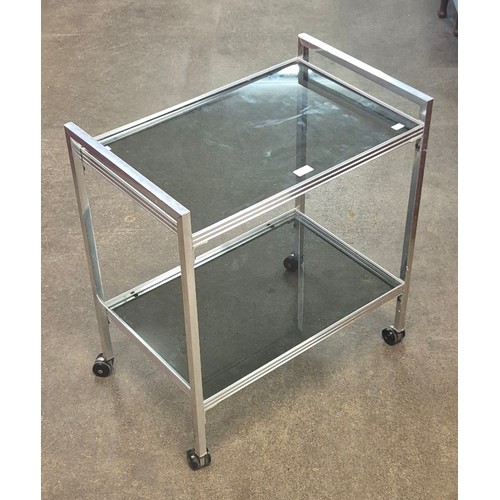 38 - A chrome and glass two tier cocktail trolley