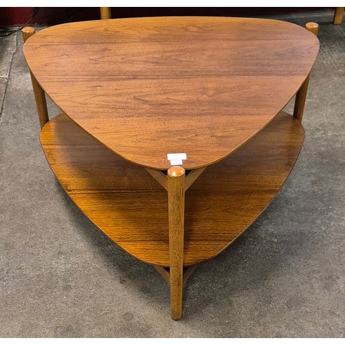 53 - A teak triangular two tier coffee table